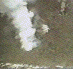 Animated sequence of white smoke-like clouds expanding against a dark gray background with subtle pixelated texture.