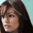 Static 48x48 pixel icon showing a close-up of a person with long dark hair against a light blue background, rendered in low-resolution pixel art style.