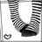 A pixelated image shows striped socks on a white background with a red containing text