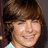 A pixelated image of a person with brown hair and a light-colored shirt on the left, next to a bright pink background with green text reading "HOT!" on the right.