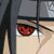 Pixelated anime-style character with red eyes and a headband, displayed in a with text overlays