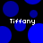 Blue circular shapes of varying sizes on a black background with four instances of the text "Tiffany" in white pixelated font.