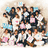 Group of people in white shirts and dark pants arranged in multiple with some individuals holding pink and blue items