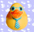 Static pixelated icon of a yellow rubber duck with blue tie against light purple background with white cloud shapes.