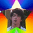 Pixelated image of a person with dark hair wearing a green shirt, set against a star-shaped background with blue, purple, orange, and yellow gradients.