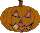 Three pixelated pumpkin faces with carved expressions, each showing distinct mouth shapes and eye lighting variations against a gray background.
