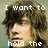 A pixelated image of a person with brown hair, showing text overlays in a with partial phrases