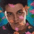Pixelated image of a person with dark hair and pink/orange face markings against a blue floral background, surrounded by green text on black.