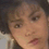 Two side-by-side pixelated faces with neutral expressions, one with light skin and the other with reddish skin, separated by a black dotted line on a dark background.