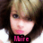 A pixelated image of a person with light brown hair and pink lips, wearing a white top, displayed in three with changing text overlays