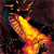 A pixelated static image shows a bright yellow-orange flame-like shape against a dark background with scattered brown and blue pixels.