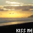 A 48x48 pixel animated buddy icon showing a sunset over water with the text "KISS ME" at the bottom, displayed as two identical frames in a contact sheet layout.