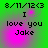 Green background with pink gradient overlay displaying text '8/11/12<3 I love you Jake' in pixelated font, animated by shifting pink glow intensity.