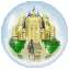A circular icon shows a golden castle with blue spires, green triangular grounds, and a small figure on the path under a light blue sky.
