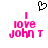 Pixelated pink text reading "I love John T" with a black heart symbol above, displayed in two identical static frames.