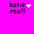 Pixelated text 'katie rox!!!' on bright pink background with animated white heart and starburst effects.