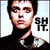 Pixelated static image of a person with dark hair wearing a black turtleneck, next to bold text reading "SHIT." on the right side against a light background.