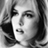Black-and-white pixelated icon of a person's face with visible hair and facial features, rendered in grayscale tones on a transparent background.