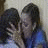 A split-frame contact sheet showing a pixelated cartoon couple kissing on the left and blue background with text "I love you!" on the right, both in low-resolution 48x48 pixels.