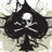 A pixelated image shows a black spade symbol with white skull and crossbones, surrounded by light gray floral patterns on the left side.