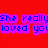 Red background with blue text on purple rectangles reading "She really... and you loved you broke her heart" over a blurred image of two red objects.