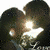 Animated sequence showing two figures in close embrace with a bright light effect between them, transitioning to a hand gesture and then a dark object held by hands.