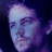 Pixelated static image of a person's face with purple and blue tones on dark background, likely intended as an AOL Instant Messenger buddy icon.