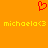 Red pixelated heart symbol above two yellow text strings reading "michaela<3" on solid orange background.