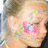 A pixelated close-up of a person's face with closed eyes, featuring pink and blue floral or decorative elements on the cheek area.