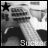 Black-and-white animated icon showing a person holding a guitar, with alternating star and white circle symbols in the top-left corner.