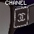 Two side-by-side pixelated images of a CHANEL logo icon with identical central design but differing top-right corner elements.