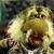 A 50x50 pixel animated buddy icon featuring a Fraggle Rock character on the left and green text reading "Original Icons .com" on the right, displayed as a contact sheet with two frames.