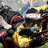 Pixelated static image of a dark-haired figure with blue and yellow accents, holding a red curved object against a blurred background.