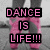 Pixelated image with pink text reading "DANCE IS LIFE!!!" over a blurred background of legs in dark pants and pink fabric.