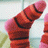 A static image shows two feet in red and pink striped socks against a light background, with blue text displaying 'i knw im cooler than u' and 'because my icon SoCkS is'