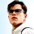 Static pixelated image of a person with dark hair, sunglasses, and light skin wearing a white shirt against a light blue background.