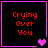 Four display red text 'Crying Over You' on black backgrounds with pink borders, each containing distinct purple heart symbols