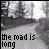 Black-and-white animated sequence showing a winding road with trees, where the text 'the road is long' changes character by character across frames.