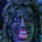 Pixelated image of a person with dark curly hair on a red background with white pixelated text.