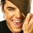 Pixelated image of a person with brown hair smiling, hand near face, on black background with white text reading 'zac efron ...uhhh....' and 'one word to explain him ...hott!!!'