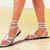 Four- shows a woman's legs in sandals, a woman in a pink skirt, a woman in a yellow dress, and a snowman with text