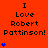 Red background with repeated text "I Love Robert Pattinson!" and blue star symbols in varying quantities per section.