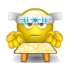 Animated yellow emoji with blue text on forehead, seated at table, performing hand gestures and mouth movements.