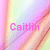Pixelated rainbow gradient background with pink text reading 'Caitlin' in the lower-left quadrant.