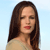 Pixelated image of a person with long dark brown hair, closed eyes, red lips, and light skin wearing a beige top against a light blue background.