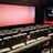A pixelated image showing a large red rectangular shape above a textured dark surface with scattered light and dark patches.