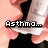 A hand holds a white inhaler with black accents, displaying text about asthma medication