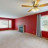 Pixelated static image showing a red building with windows and a ceiling fixture, viewed from an interior perspective.