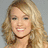 A pixelated image of a smiling woman with blonde hair on the left, next to blue background text reading "when you figure out LOVE is all that matters after all it sure makes everything else seem So Small!".