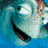 Pixelated image of a stylized face with large white eyes, black pupils, and a wide black mouth with red accents, set against a blue and teal background.
